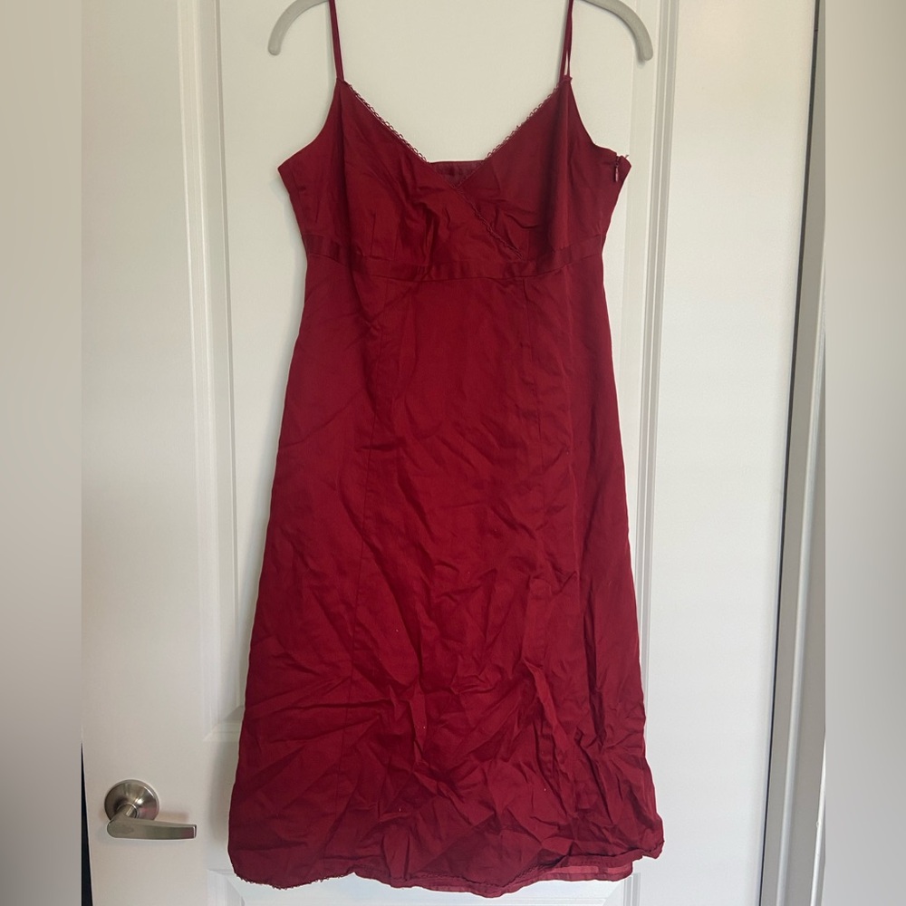 Dark red, semi formal mini dress with lace trim on the neck and hem. Size 8.
